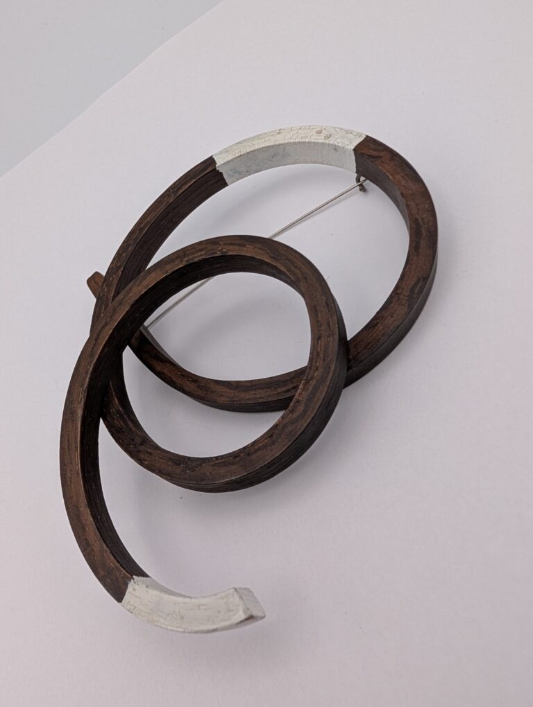 Open Coil Brooch by Gustav Reyes.