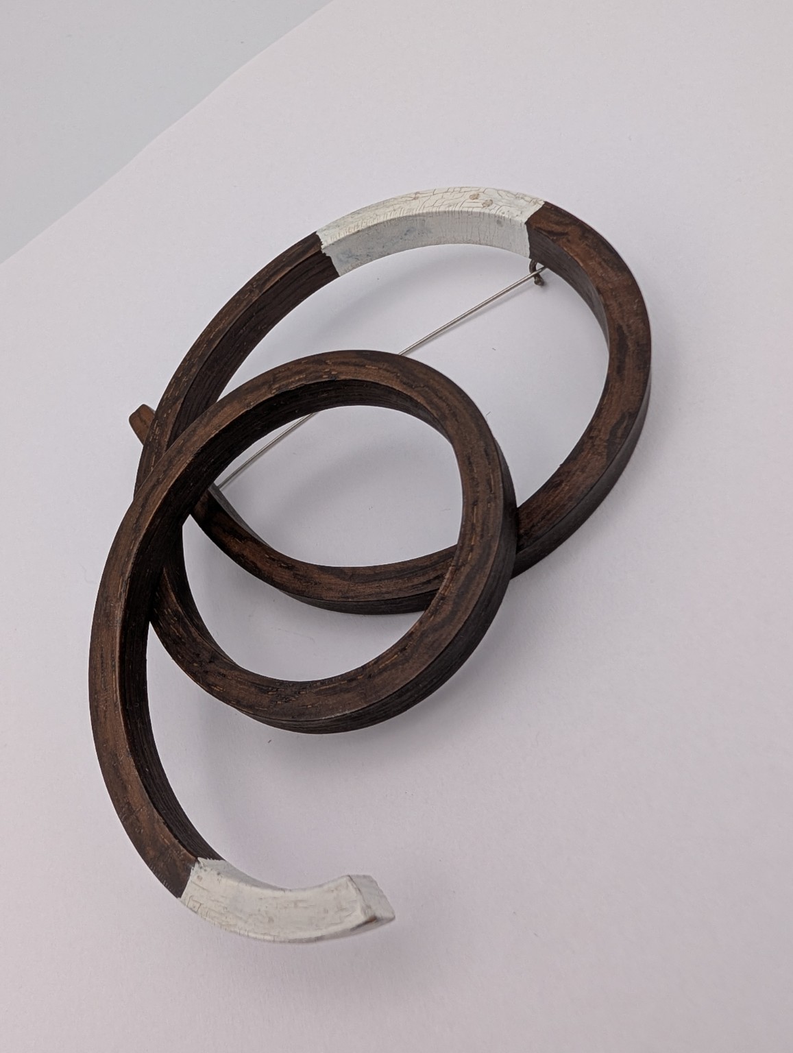 Open Coil Brooch by Gustav Reyes.