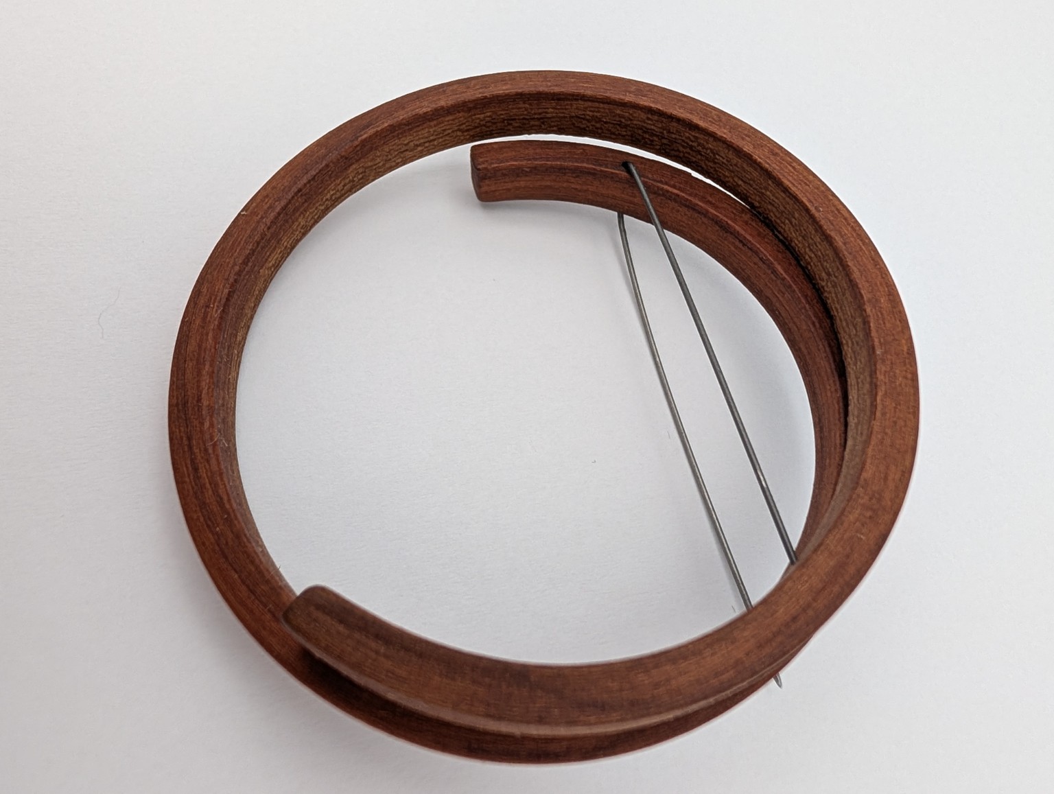 The Interval Brooch by Gustav Reyes.