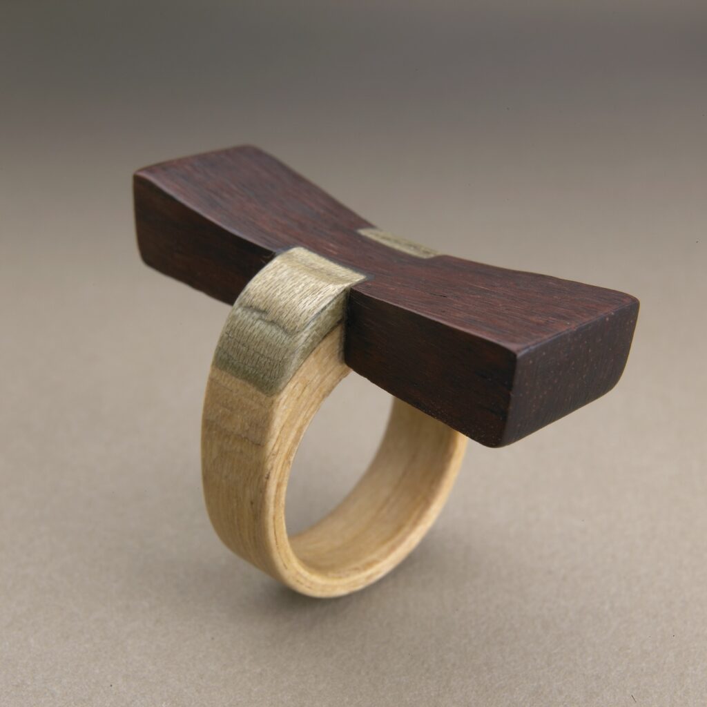 The Key, a 2008 sculptural wooden ring by Gustav Reyes.